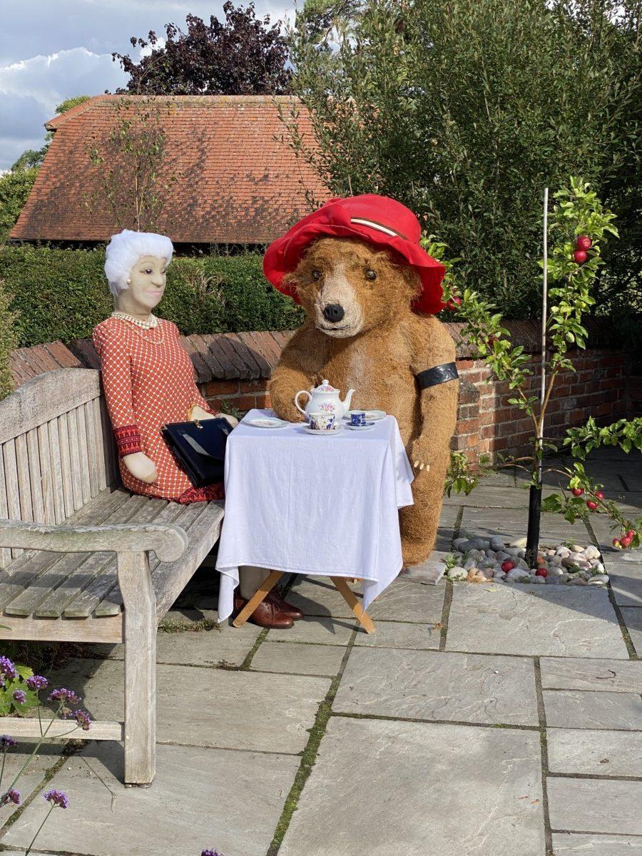 Paddington taking tea with the Queen at Scarecrows 2022